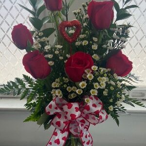 Half dozen of roses.   Vase